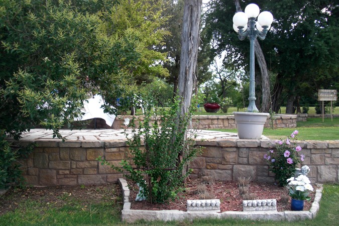 "Rocked Multi-Levels of Gardens & Trees Welcome Guests"
